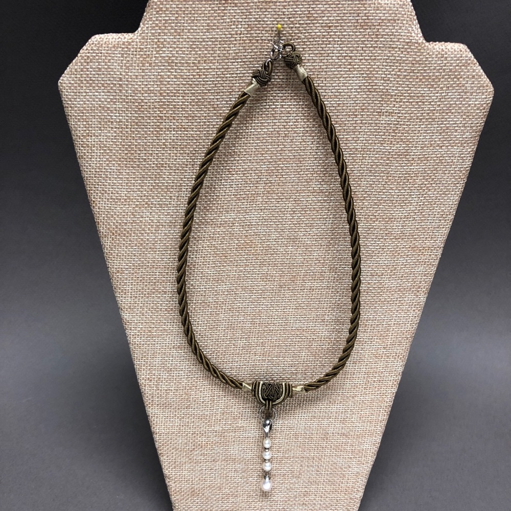Pearl necklace on silk cording.